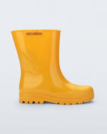 Side view of an orange Welly kids rainboot