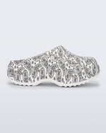 Side view of a white Free Clog Print Platform with black paisley print.