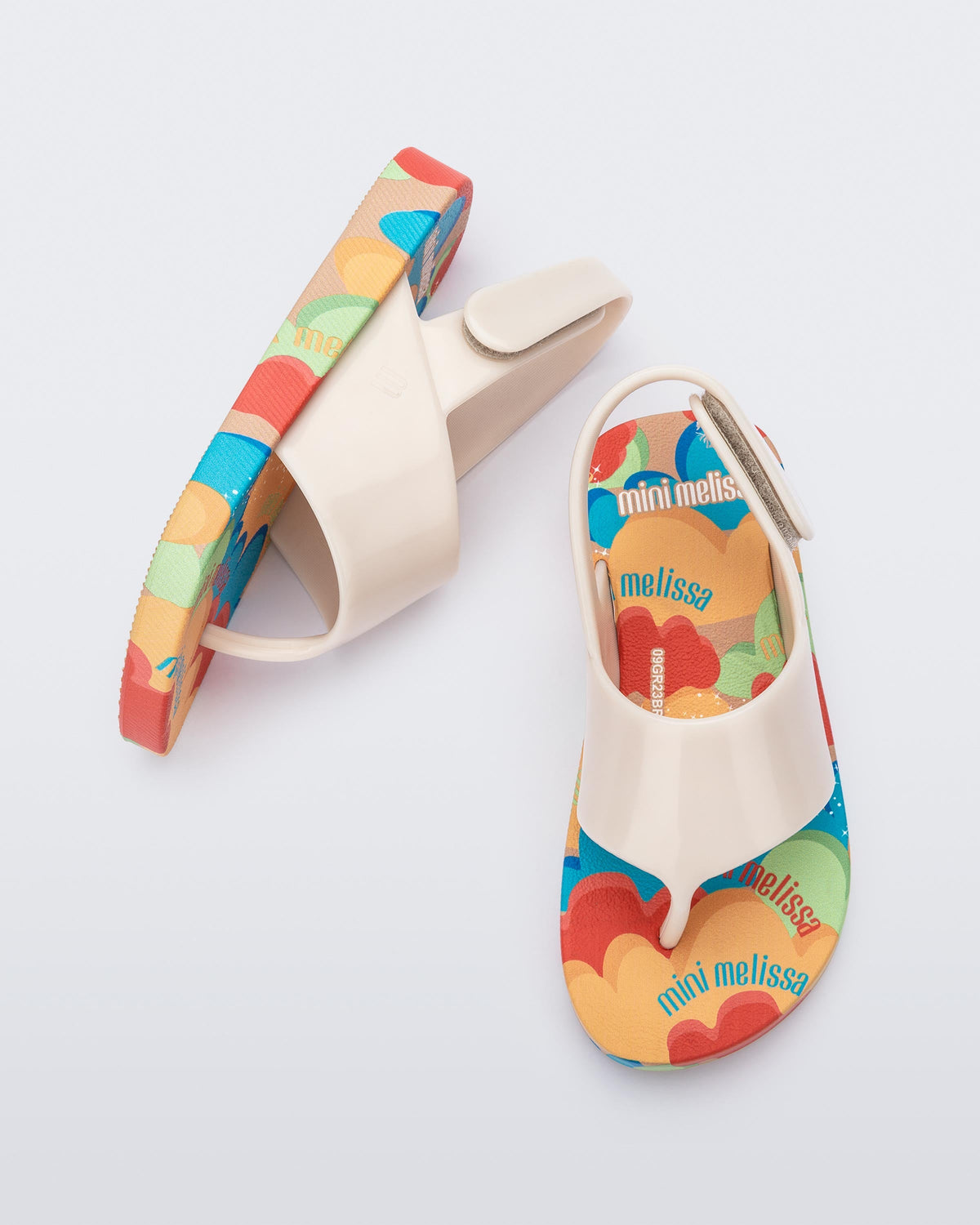 Top and side view of a pair of beige Shiny baby sandals with multicolor sole