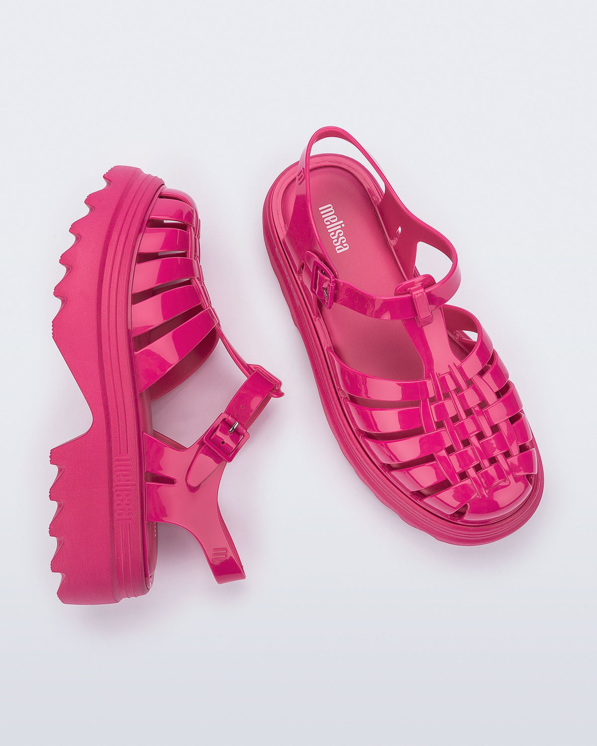Side and top view of a pair of pink Possession Platform II sandals.