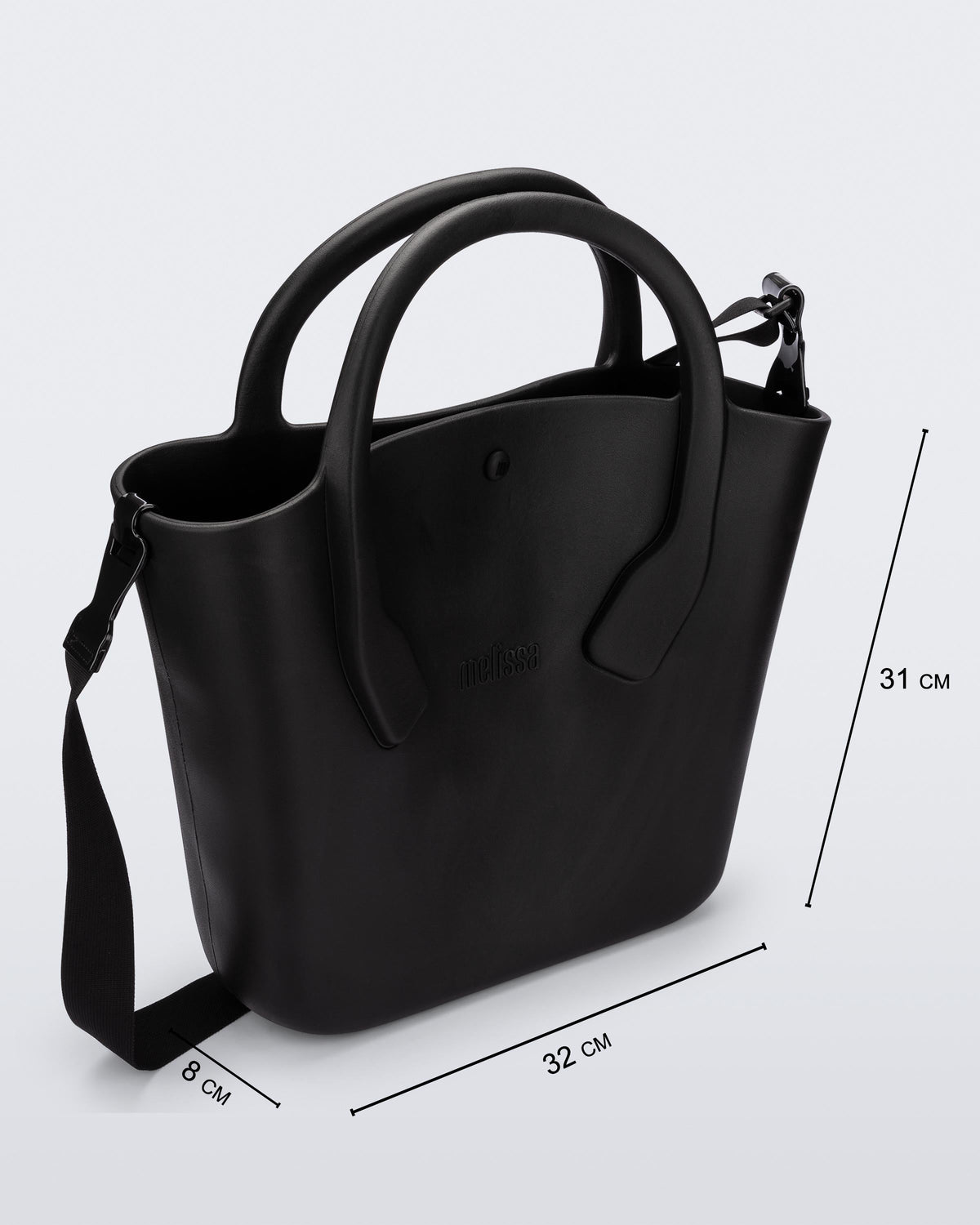 Angled view of a black Free Big Bag with handles and a strap and dimensions 32 cm length, 8 cm width, 31 cm height