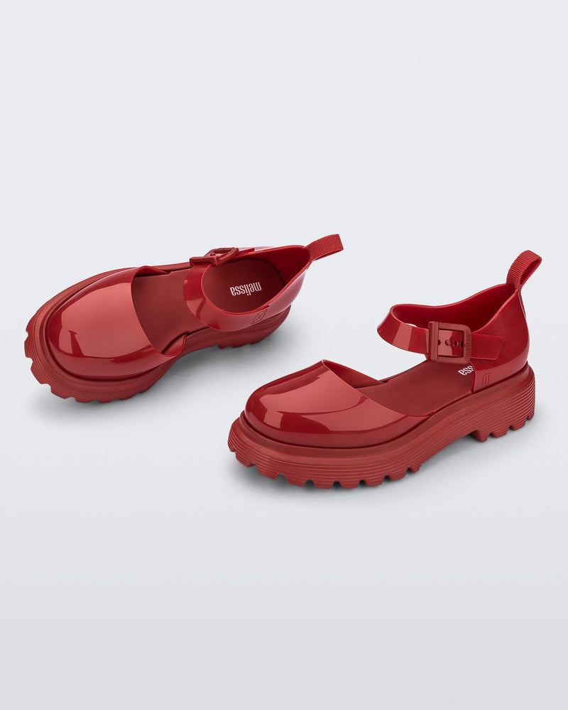 Side and angled view of a pair red Ellie ankle strap loafers