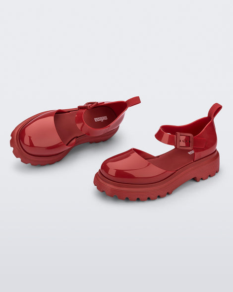 Side and angled view of a pair red Ellie ankle strap loafers