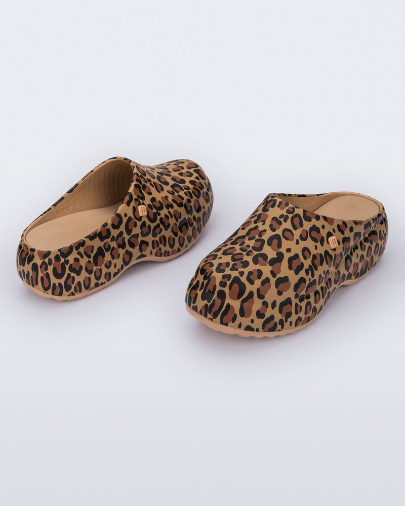 Front and back angled view of a pair of beige/black leopard print Free Clog Print platforms