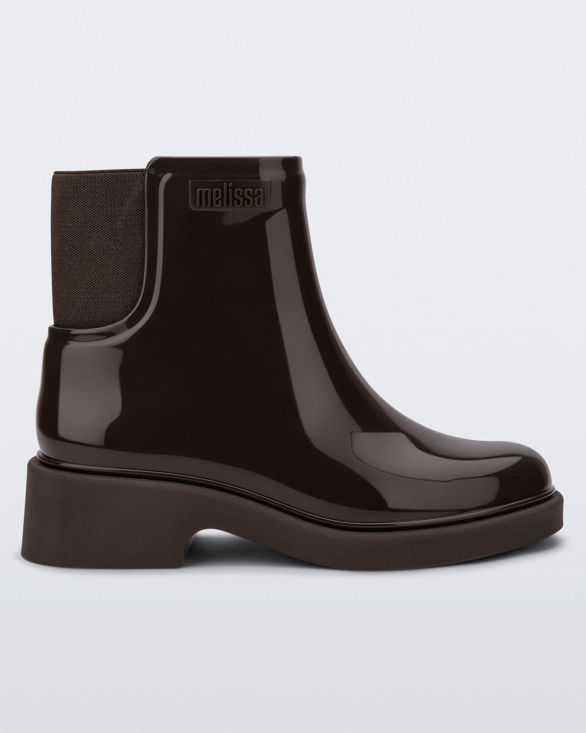 Side view of a dark brown Chelsea boot