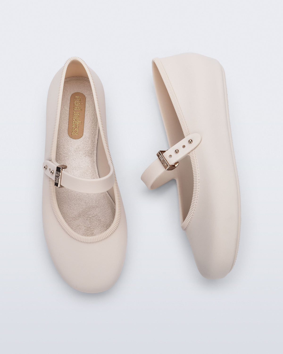 Top and side view of a pair of beige Soft Ballerina kids flat with strap