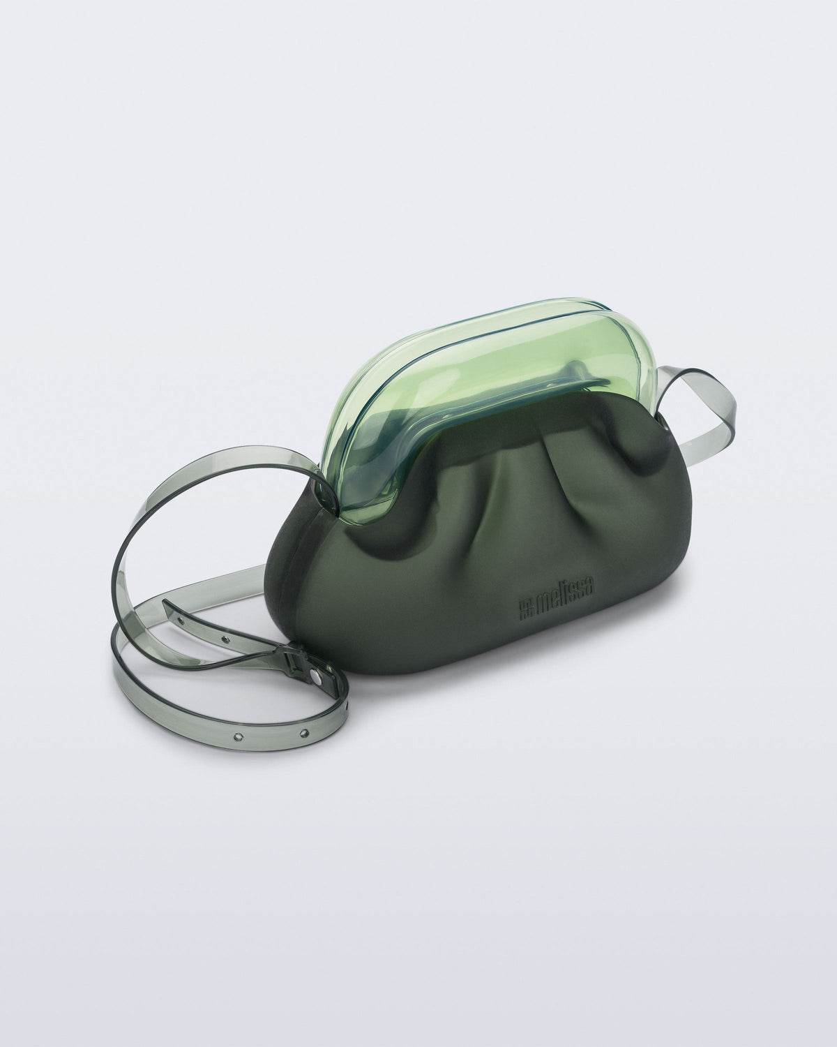 Angled view of a small green bag with clear green clutch and long strap