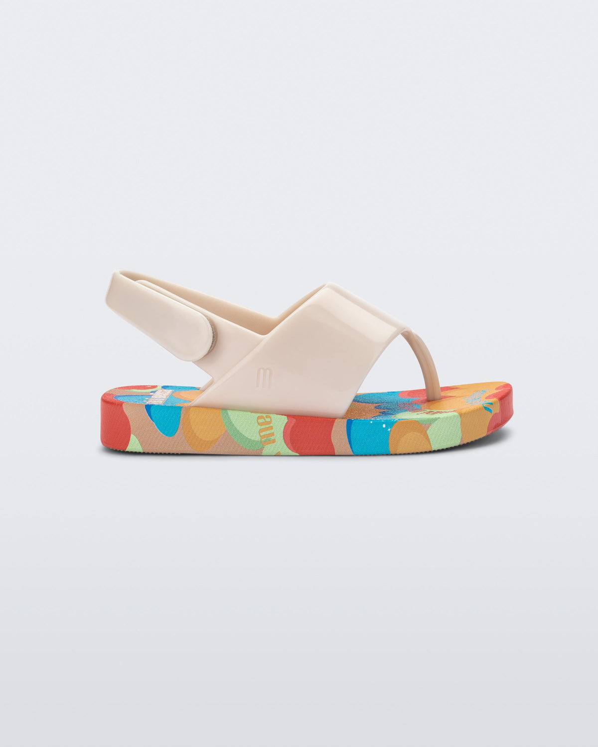 Side view of a beige Shiny baby sandals with multicolor sole