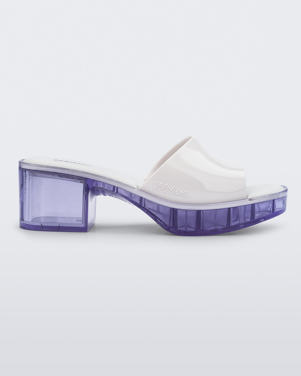 Side view of a Melissa Shape slide with clear heel and white wide strap