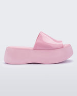 Side view of a pink Melissa Becky platform slide.