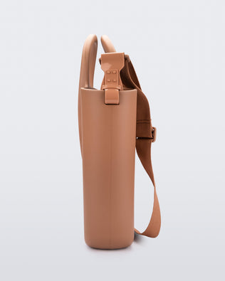Side view of a brown Free Big Bag with handles and a strap