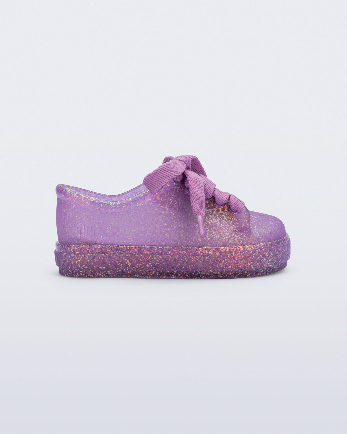 Side view of a glitter lilac baby Hip Sneaker with lilac laces