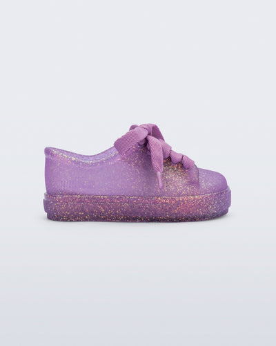 Side view of a glitter lilac baby Hip Sneaker with lilac laces