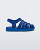 Side view of a blue Megan baby sandal.