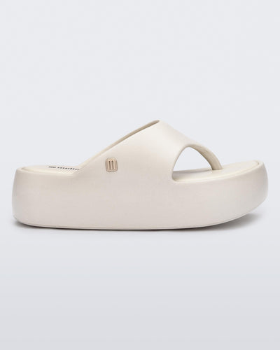 Side view of a beige Free Platform Thong sandal