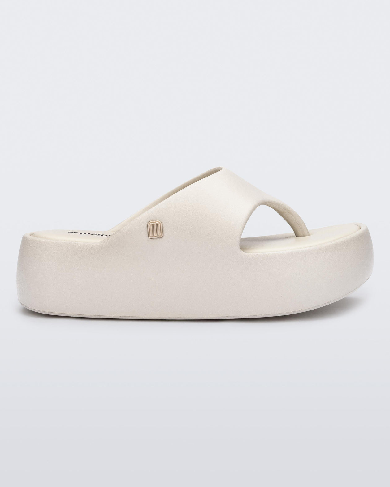 Side view of a beige Free Platform Thong sandal