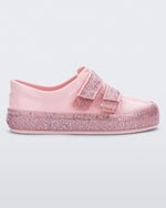 Side view of a Pink/Pink Glitter Mini Melissa Beanny Bugs sneaker with a pink base, two shiny pink velcro straps and a pink glitter sole.