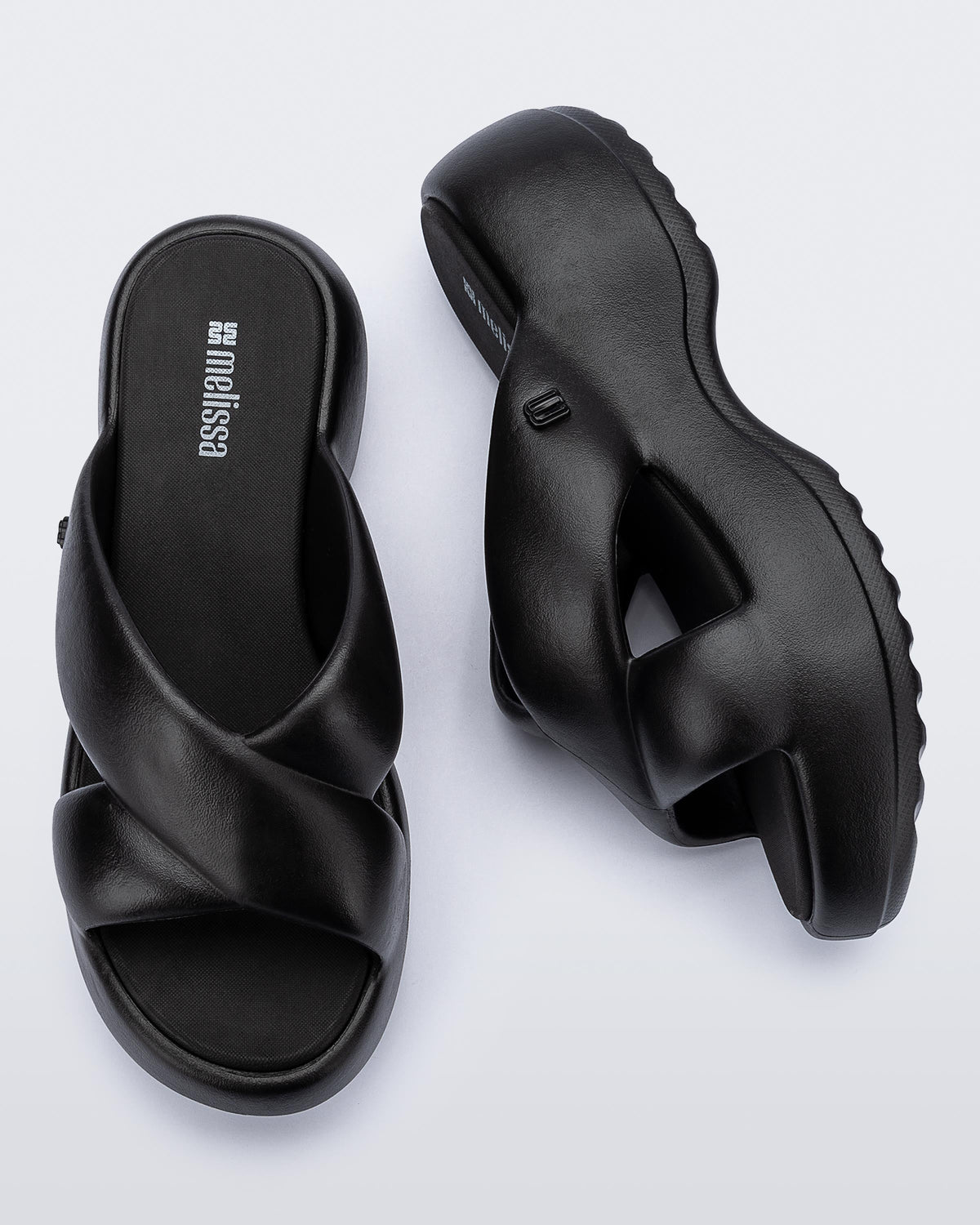 Side and top  view of a pair of black Free Rise platform slide