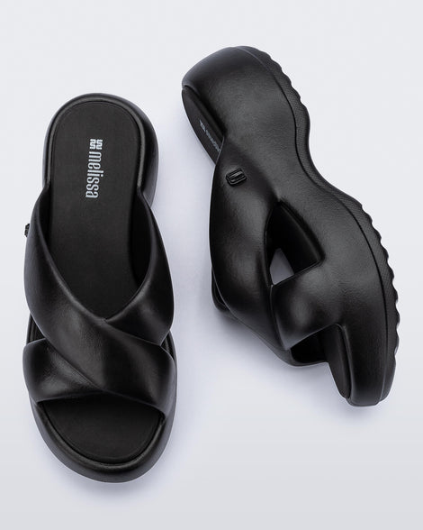 Side and top  view of a pair of black Free Rise platform slide