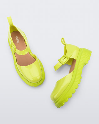 Side and top view of a pair green Ellie ankle strap loafers