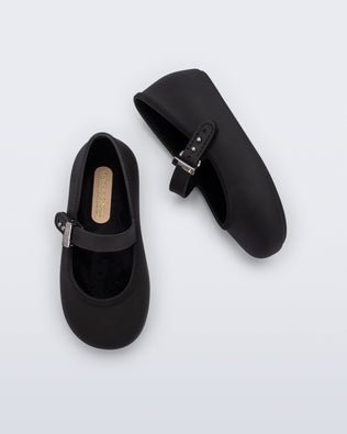 Top and side view of a pair of black Soft Ballerina baby flat with Velcro strap