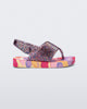 Side view of a lilac glitter Shiny baby sandals with multicolor sole