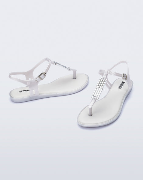 Side and front view of a pair of pearly white Solar M Chic sandals