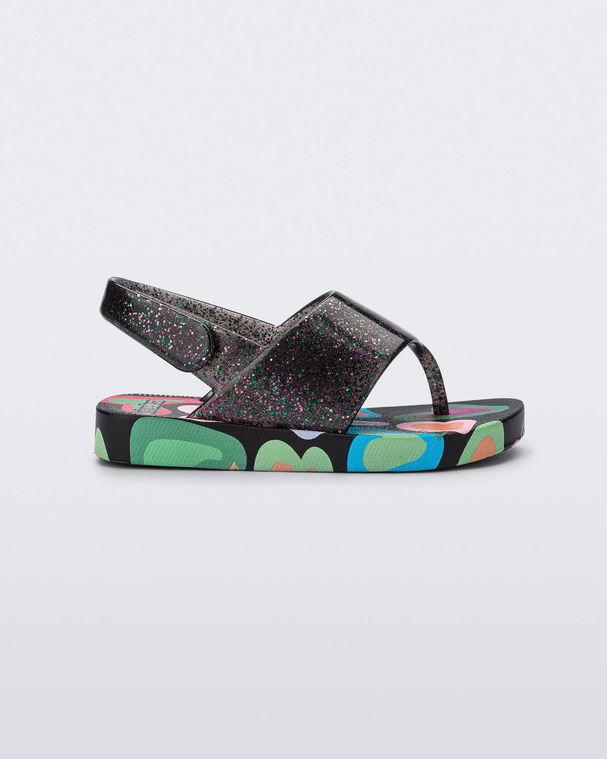 Side view of a black glitter Shiny baby sandals with multicolor sole