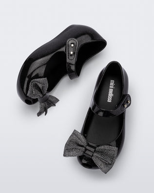 Top and side view of a pair of black glitter Ultragirl Sweet baby ballerina flats