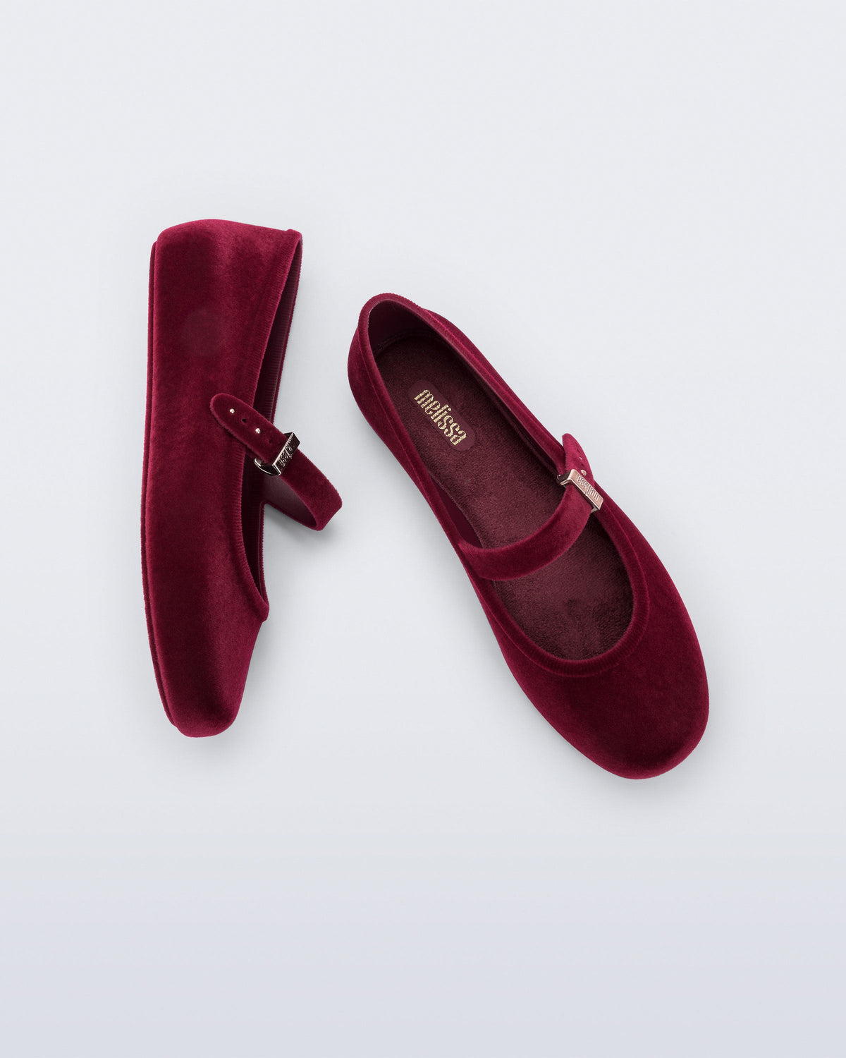 Side and top view of a pair of red Soft Ballerina Velvet II flats