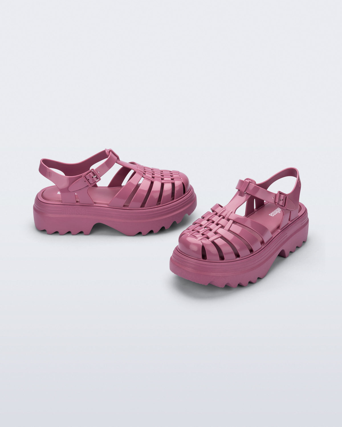 Side and front angled view of a pair of lilac Possession Platform II fisherman sandals