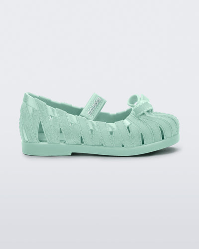 Side view of a glitter green M Lover Ballerina baby flat with bow and strap