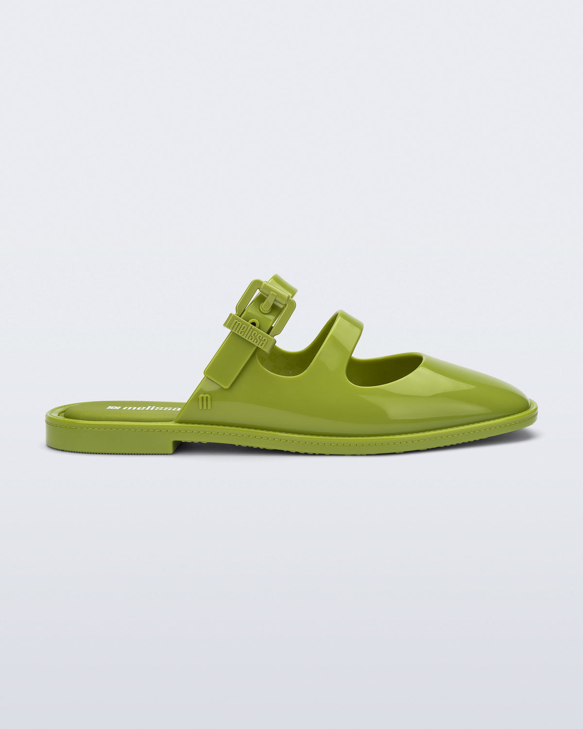 Side view of a green Anastasia mule slide with upper straps