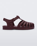 Side view of a matte burgundy Possession kids fisherman sandal.