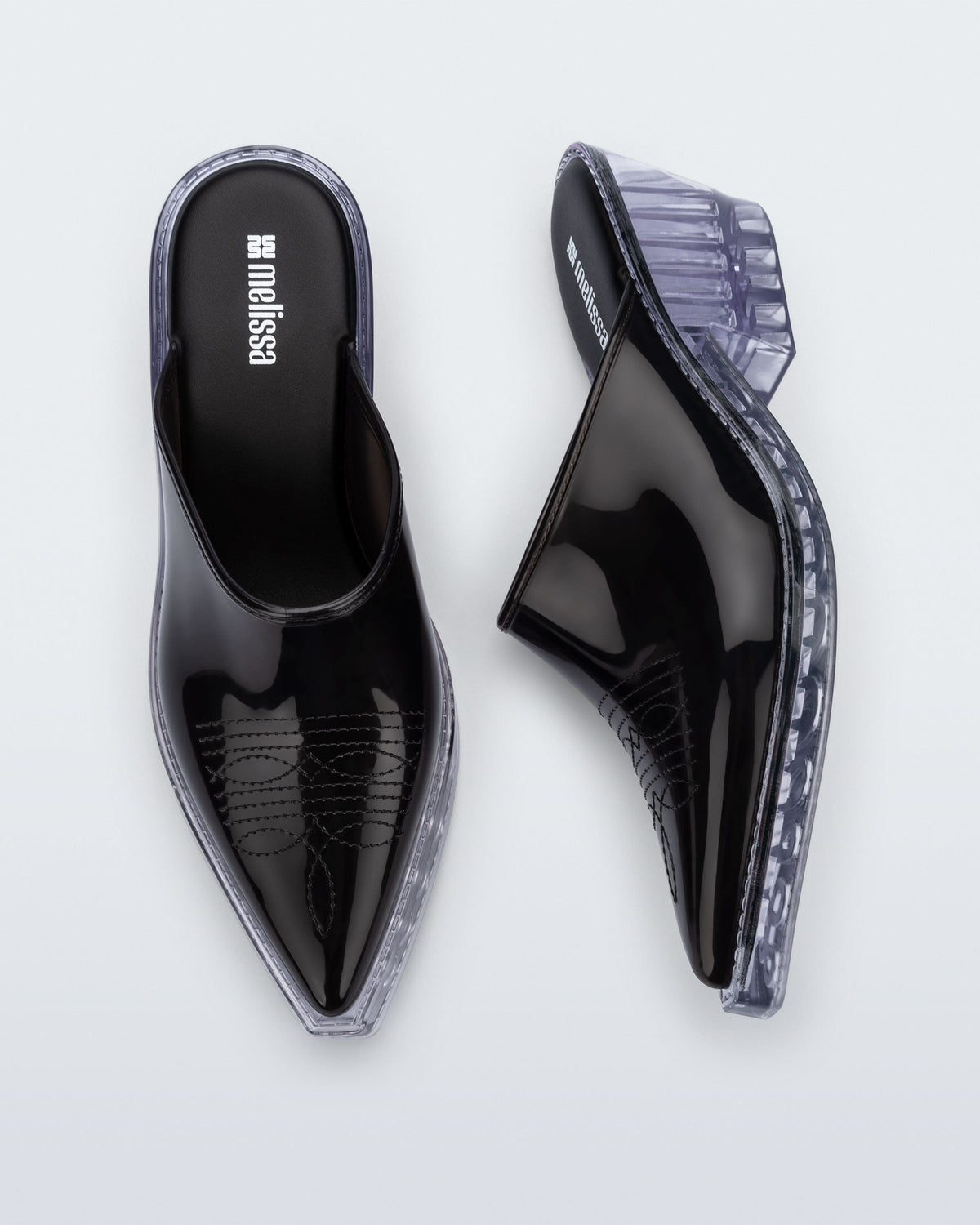 Side and top view of a pair of black with clear heel Texas Mule heels