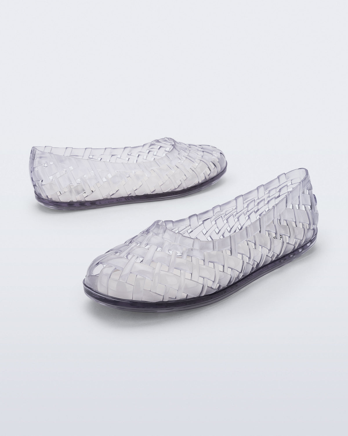 Angled and side view of a pair of clear Possession Ballerina flats