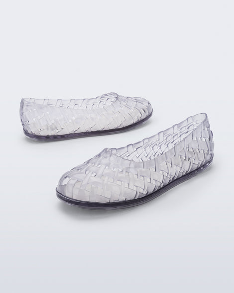 Angled and side view of a pair of clear Possession Ballerina flats