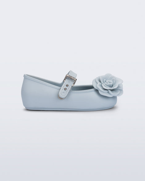 Side view of a blue Soft Ballerina baby flat with blue flowers