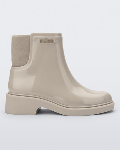 Side view of a beige Chelsea boot