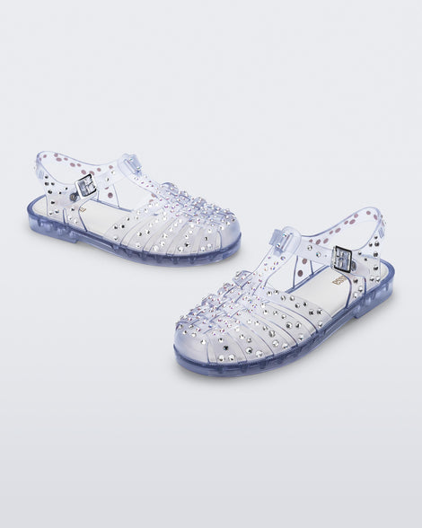 Angled view of a pair of clear Possession Crystals sandals