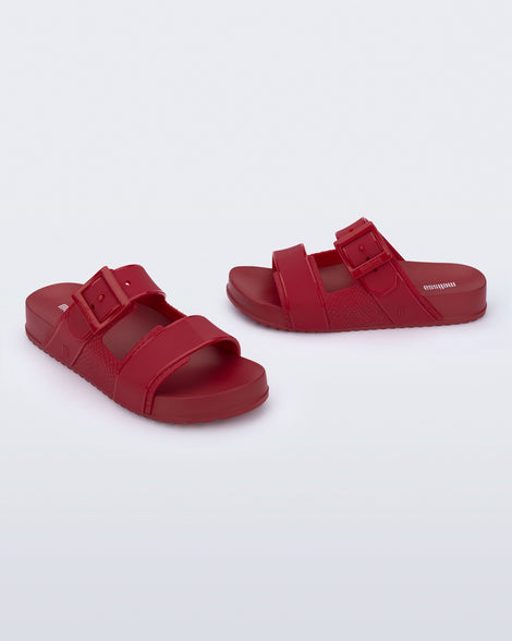 Angled view of a pair of red Cozy Connection slides