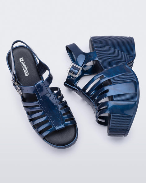 Top and side view of a pair of blue Station 79 platform heels with ankle straps