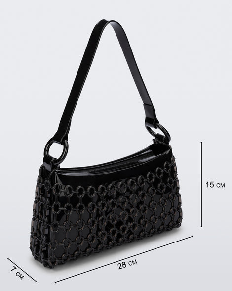 Angled view of a black Hoop bag with short shoulder strap with bag dimensions: 28 cm x 7 cm x 15 cm