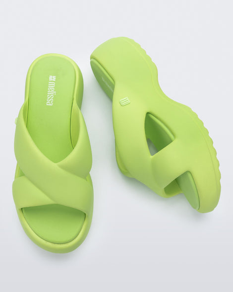 Side and top  view of a pair of green Free Rise platform slide