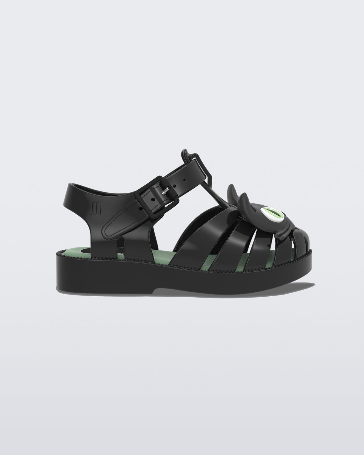 Side view of a black baby Possession Cat flat
