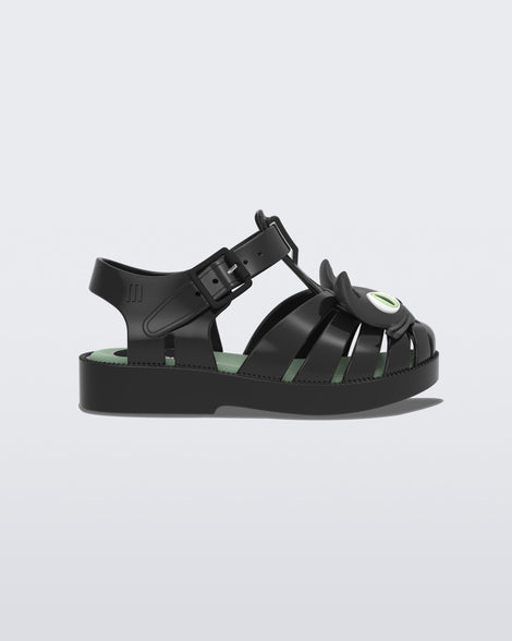 Side view of a black baby Possession Cat flat