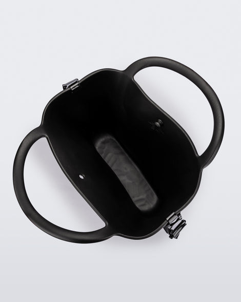 Top view of a black Free Big Bag with handles and a strap