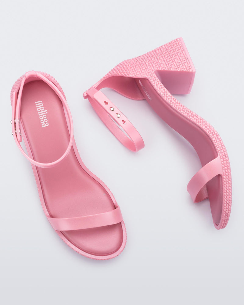 Top and side view of a pair of metallic pink Lux Heels