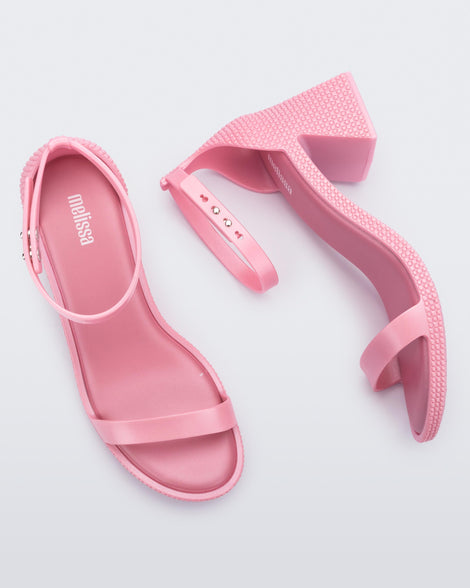Top and side view of a pair of metallic pink Lux Heels