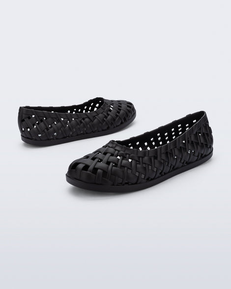 Angled and side view of a pair of black Possession Ballerina flats